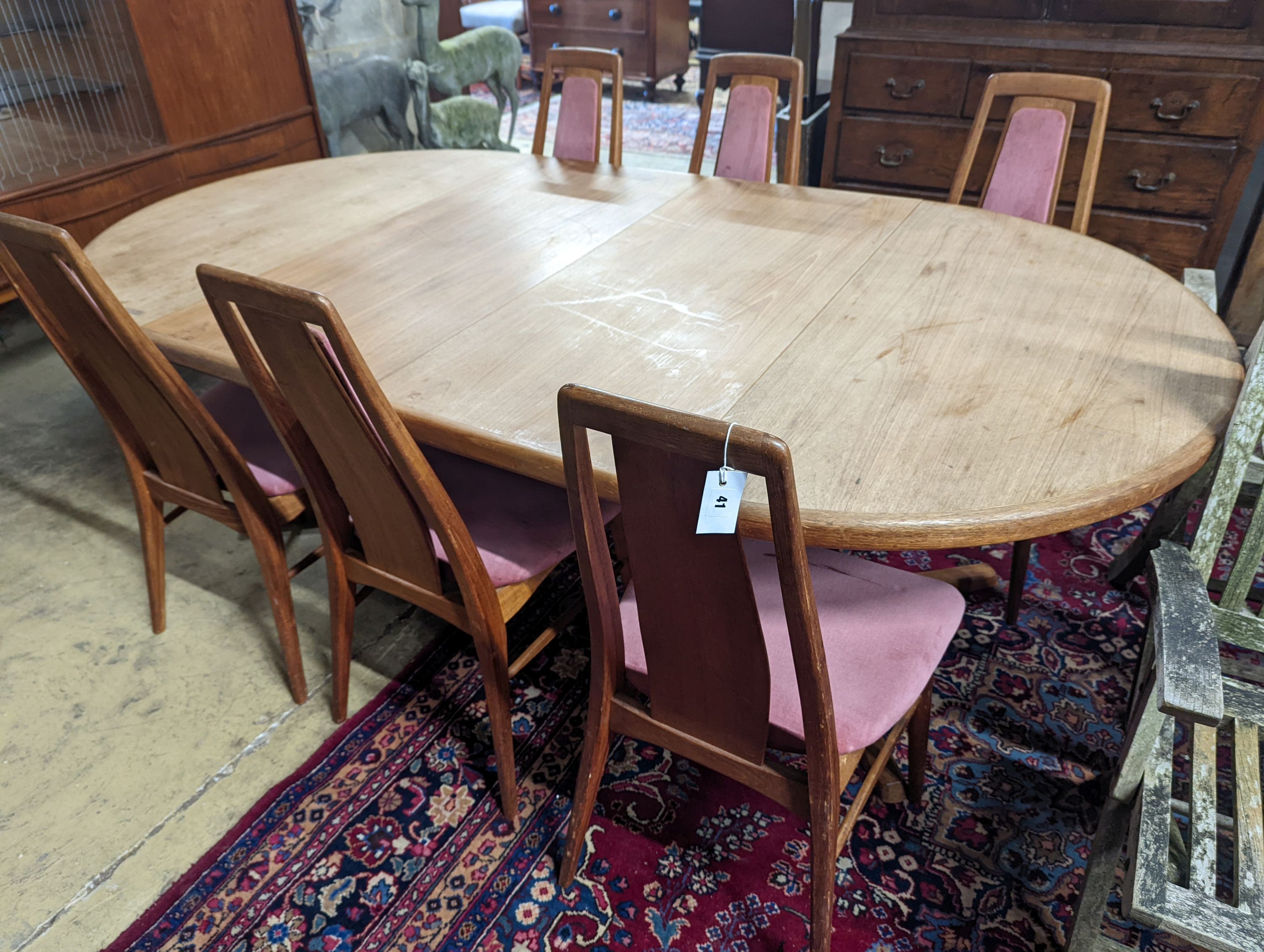A set of six Niels Koefoed teak dining chairs and circular Danish teak dining table, 220cm extended, two spare leaves, depth 120cm, height 73cm